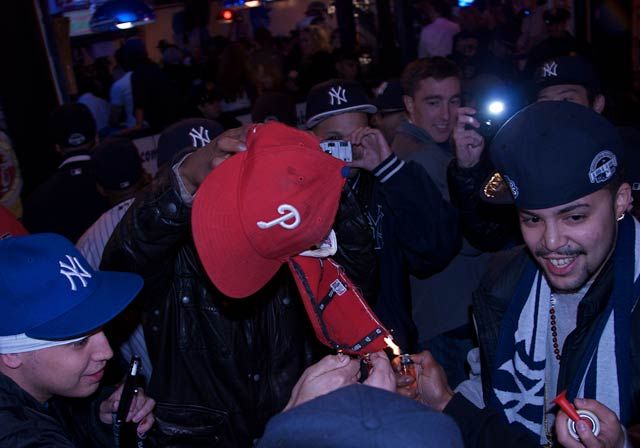 What happens when victorious Yankees fans get a hold of a Phillies cap